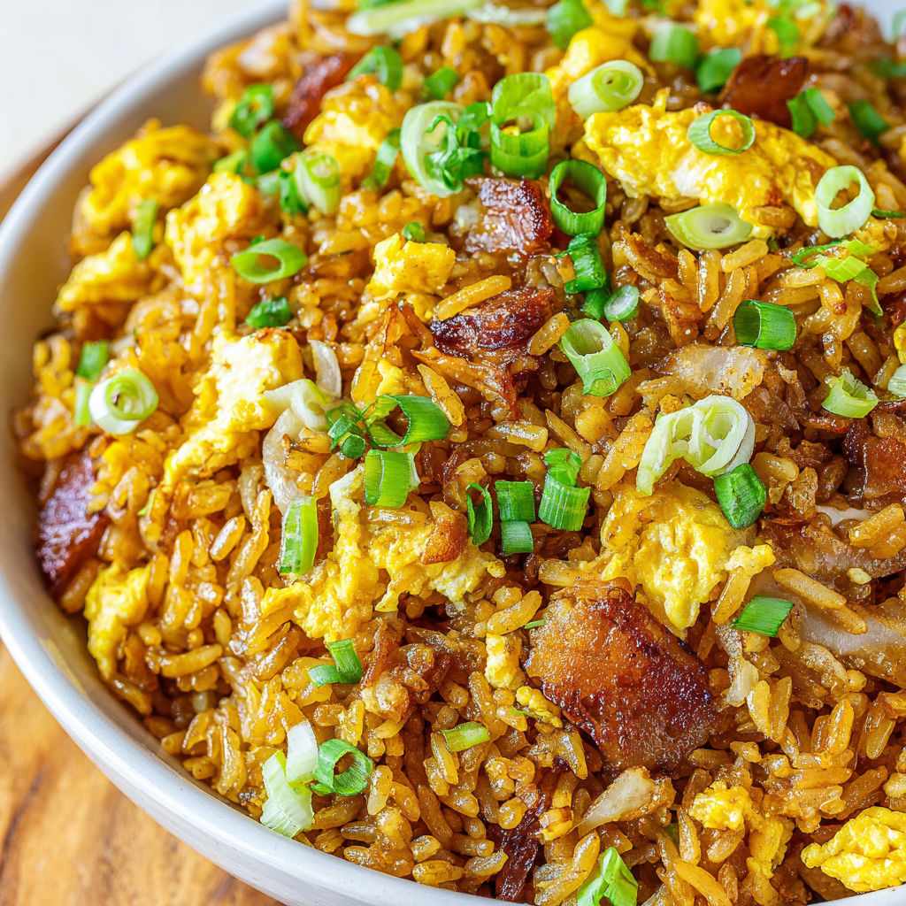 A bowl of hibachi fried rice with vegetables.