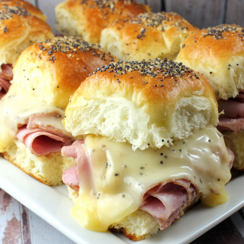 A plate of ham and cheese sandwiches.
