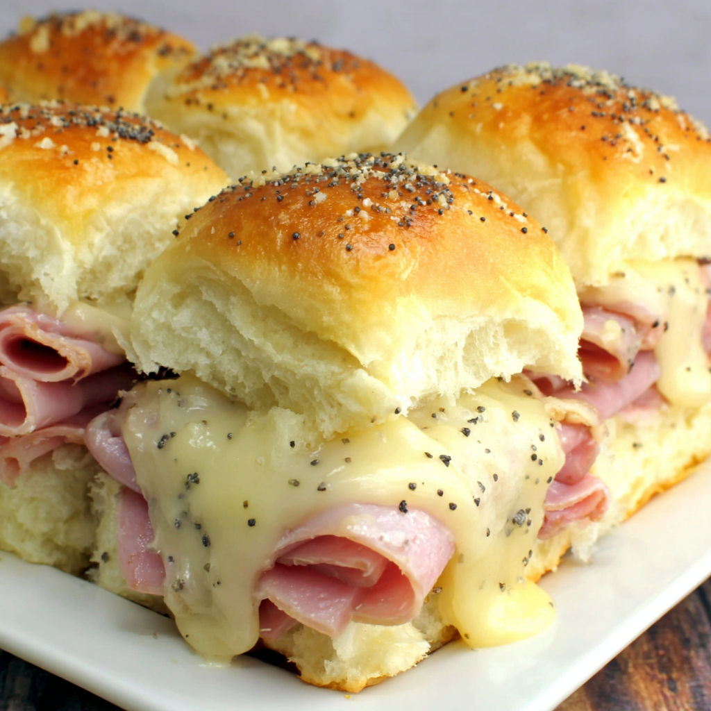 A plate of ham and cheese sandwiches.