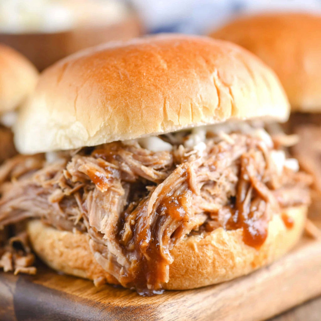 A close up of a pulled pork sandwich.