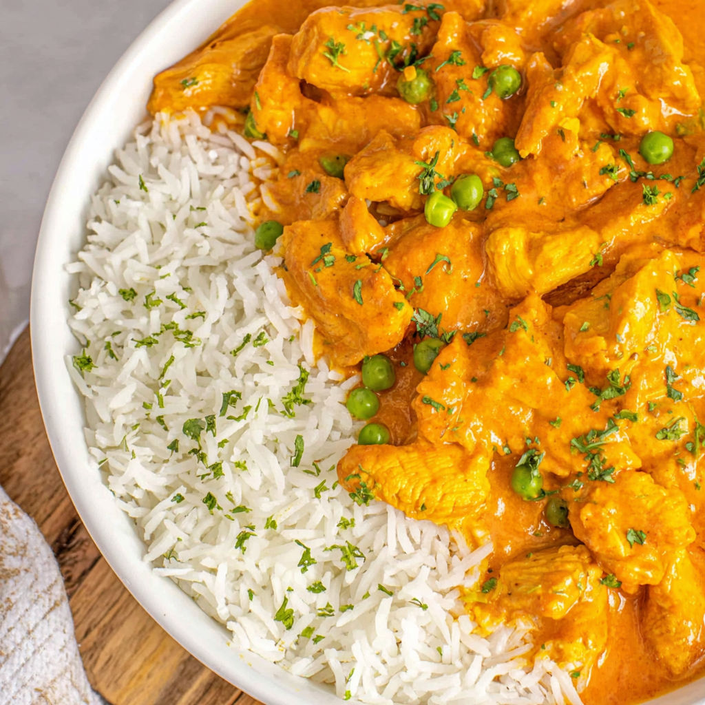 A bowl of rice and chicken.