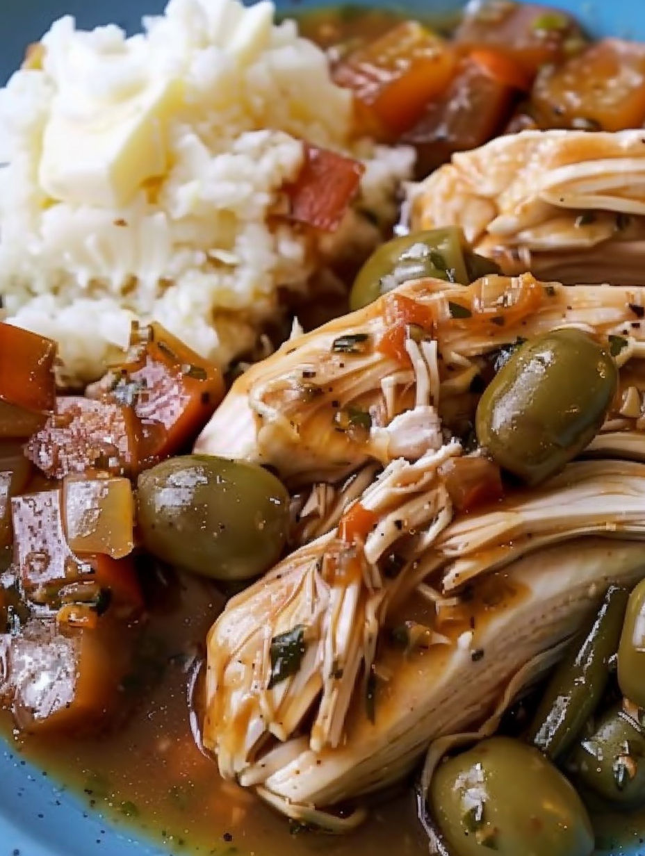 A plate of Mississippi chicken with rice and green beans.