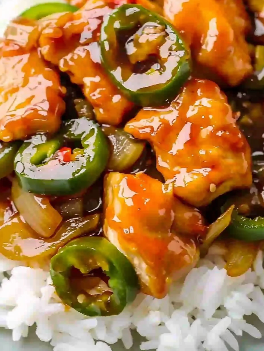 A plate of jalapeno chicken with rice.