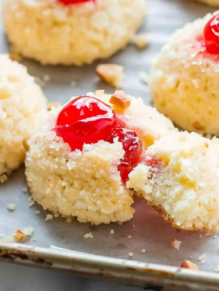 A cookie with a cherry on top.