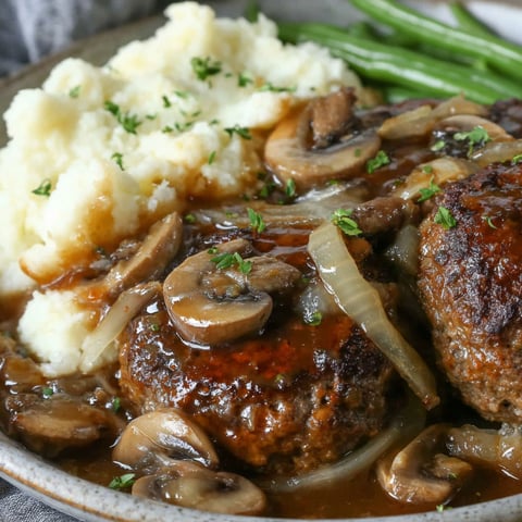 A plate of food with mushrooms and onions.