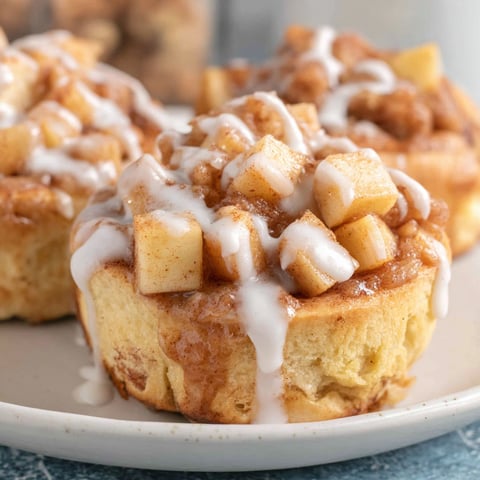 Two cinnamon rolls with apple filling.