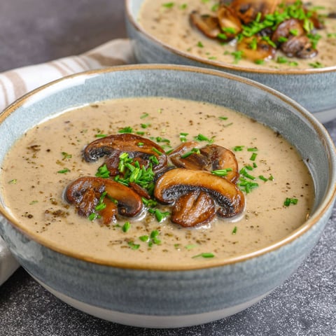 A bowl of creamy salsa chicken with mushrooms.