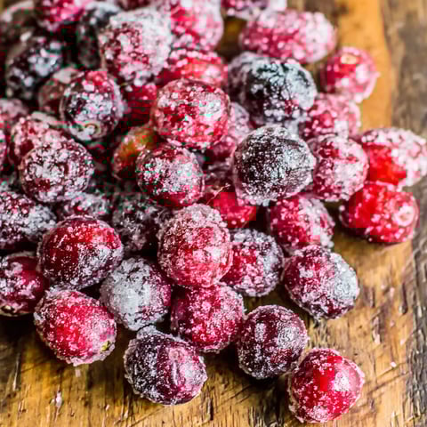 A pile of cranberries covered in sugar.