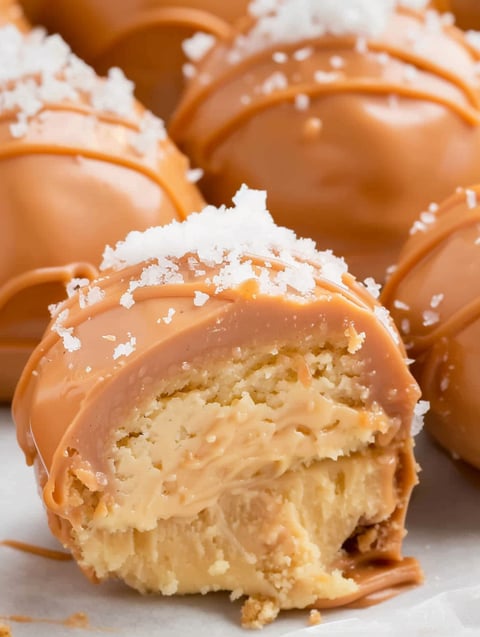 A close up of a caramel cheesecake bite.