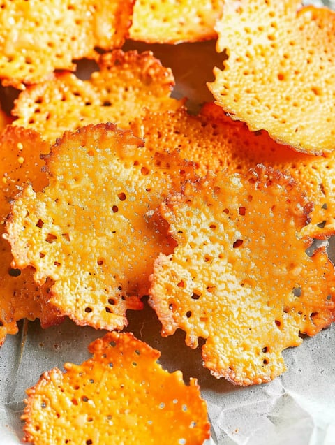 Baked cheese crisps on a tray.