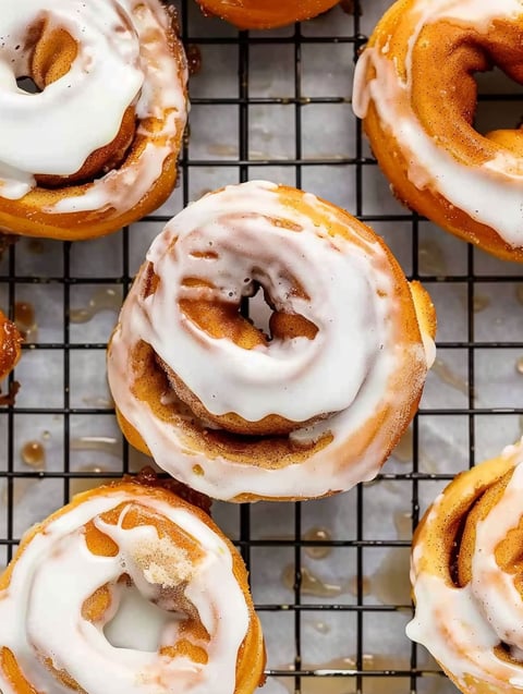 A tray of cinnamon rolls donuts.