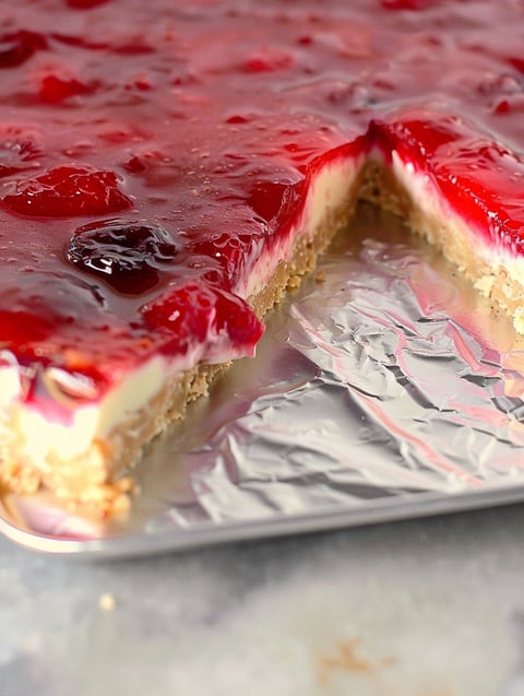 A slice of lemon raspberry fruit pizza.