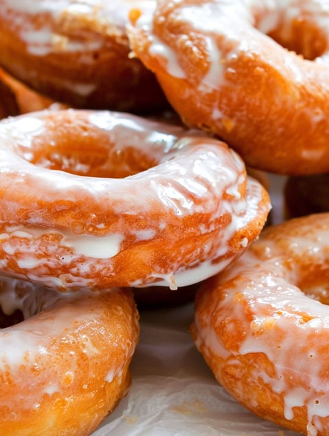 A plate of sour cream cake donuts.