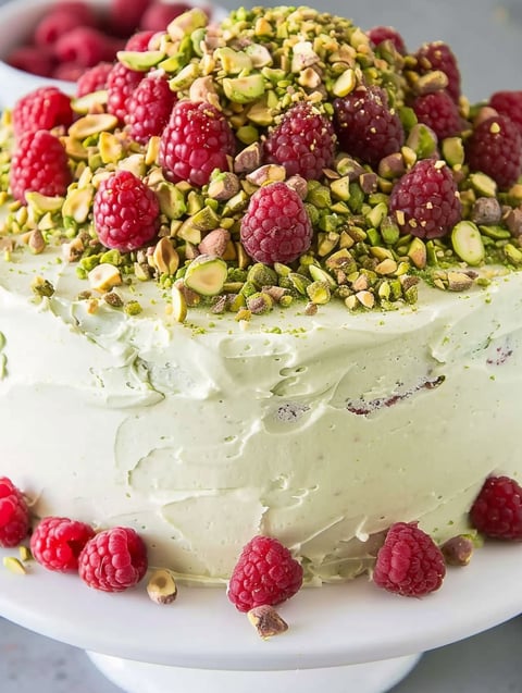 A close up of a Raspberry Pistachio Cake.